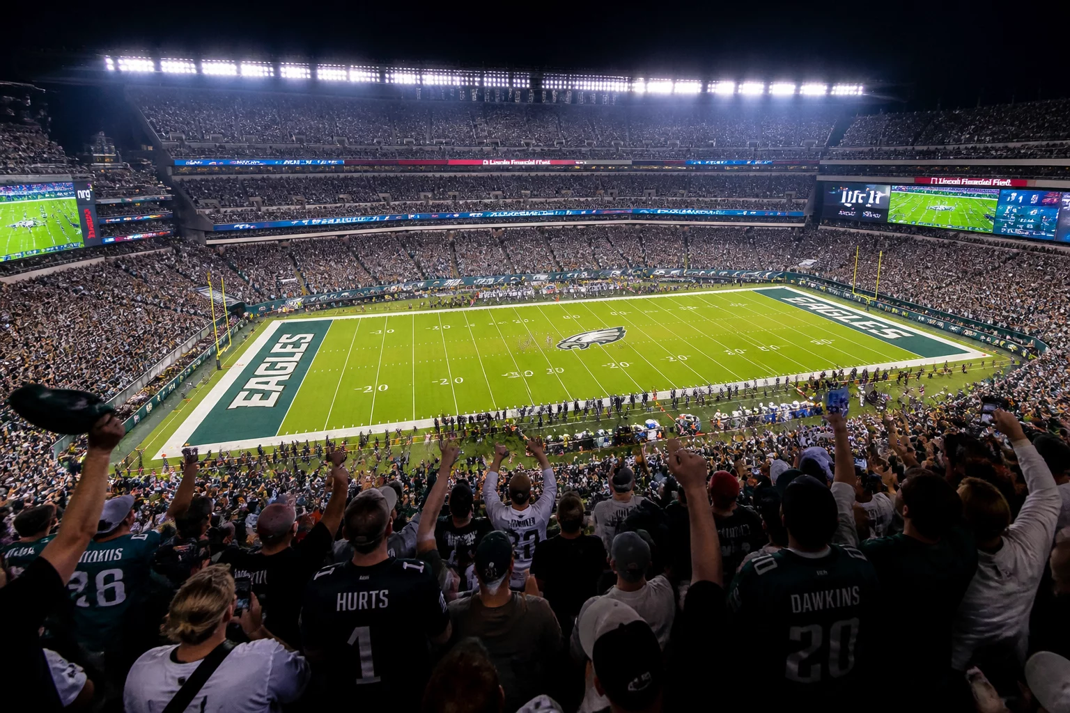 Filled stadium stands and green field